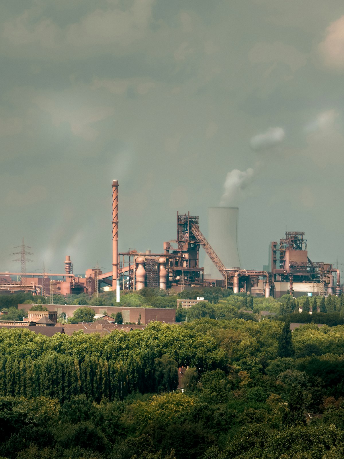 Industrial facility with smokestacks representing stack emissions monitoring