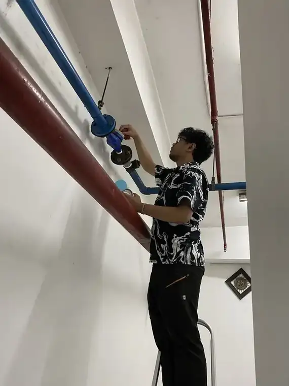 Engineer installing an OCR water meter on a pipe